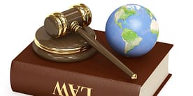 Law book, gavel and globe